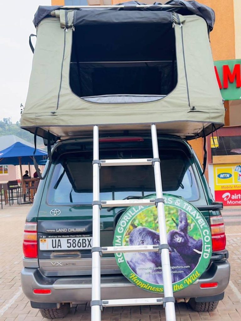 Toyota 4x4 car rental Rwanda rooftop tent parked in Akagera National Park by Rwanda Rent Car