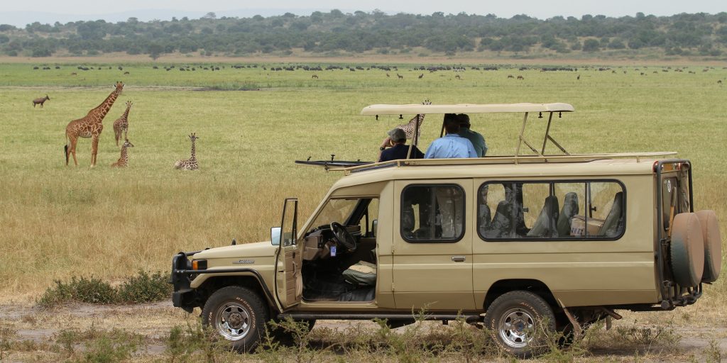 Premium 4x4 safari vehicle exploring the mountainous countryside on one of our custom Rwanda self drive tours with Rwanda Rent Car